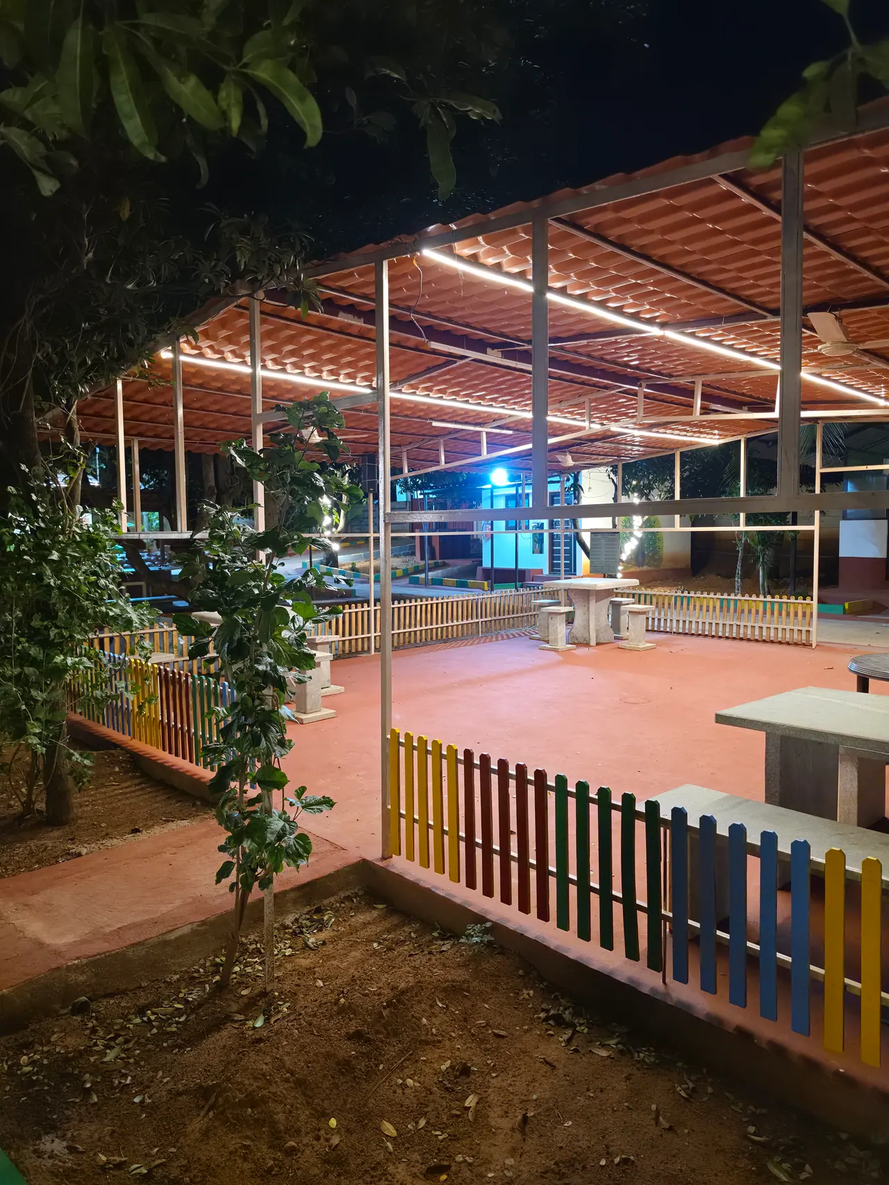 Central open hall at Ram Vishranti Dhama illuminated at night